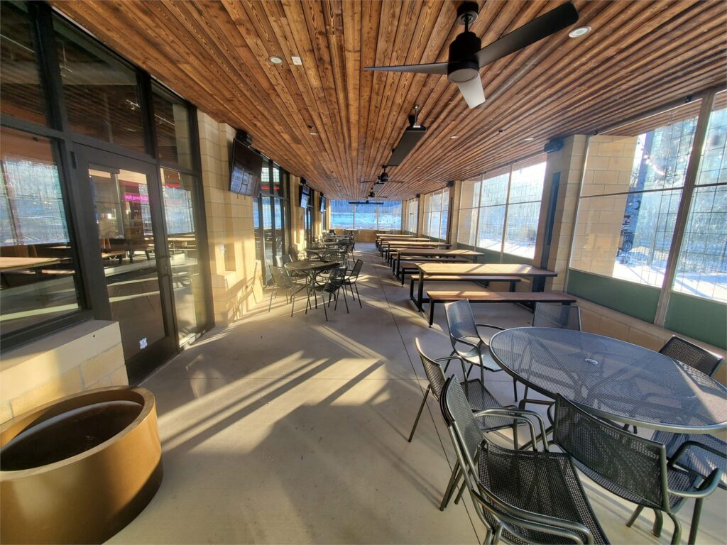 Enclosed patio dining area at Char Bar Parkville